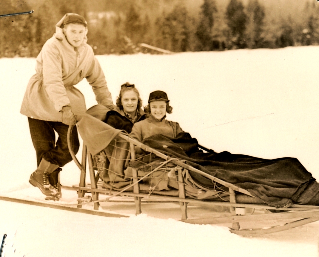 Two girls from Syracuse University enjoy a dog sled ride on a WPA-improved trail at Lake Placid, New York. Photo courtesy of the National Archives (ca. 1935-1943).