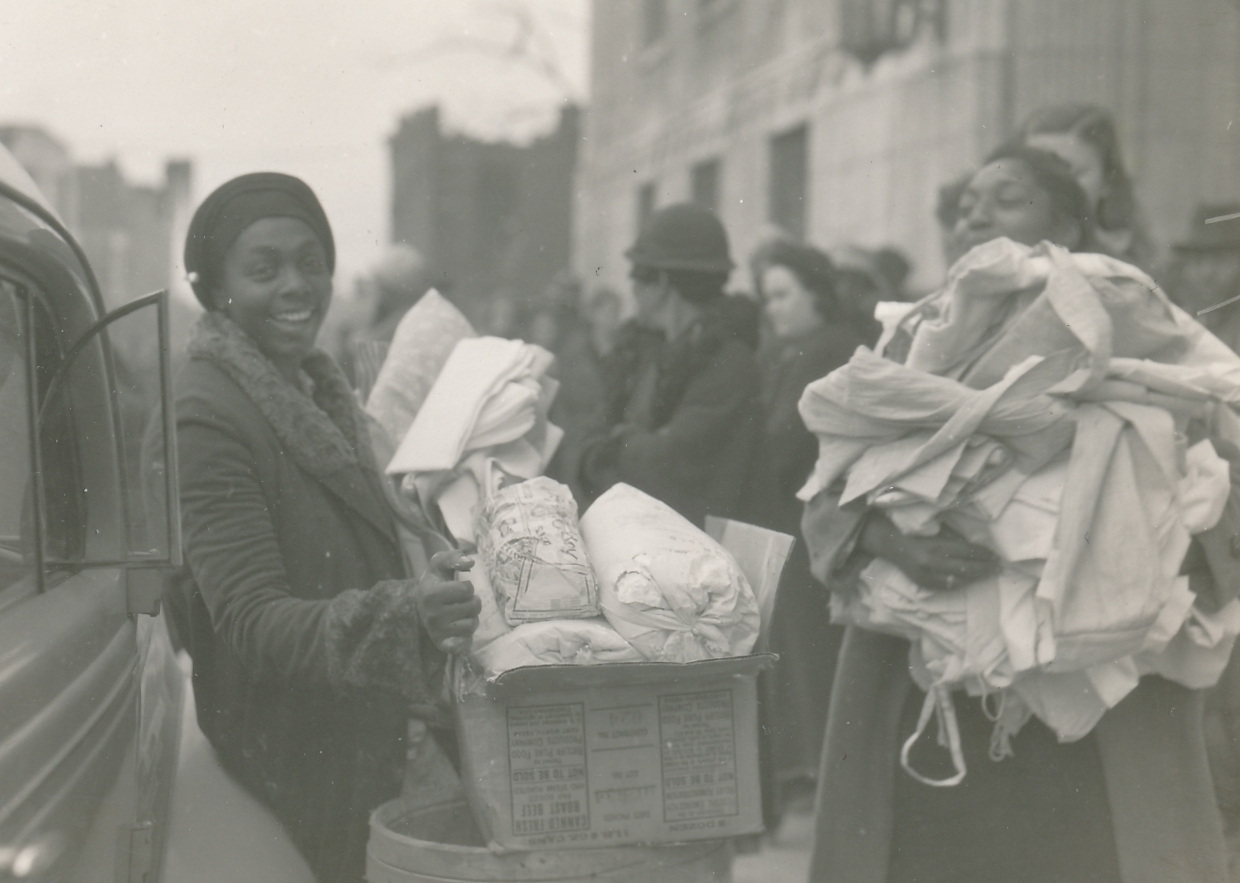 WPA-supplied food and clothing brings a smile of relief in the aftermath of the deadly Gainesville Tornado of 1936 (Georgia). Photo courtesy of the National Archives (April 1936).