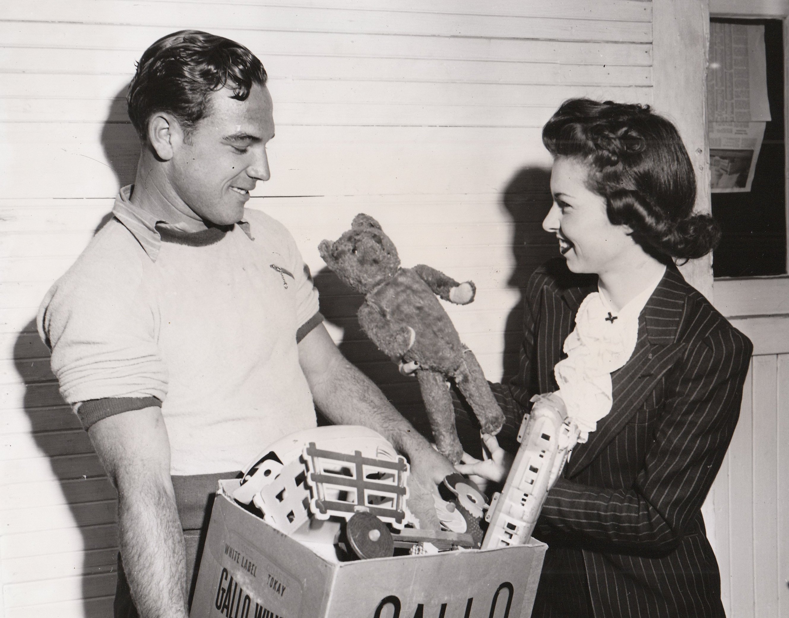 NYA workers Ray Schakel and Mary Weissker prepare to recondition and distribute donated toys to underprivileged children in Long Beach, California. Photo courtesy of the National Archives (ca. 1935-1943).