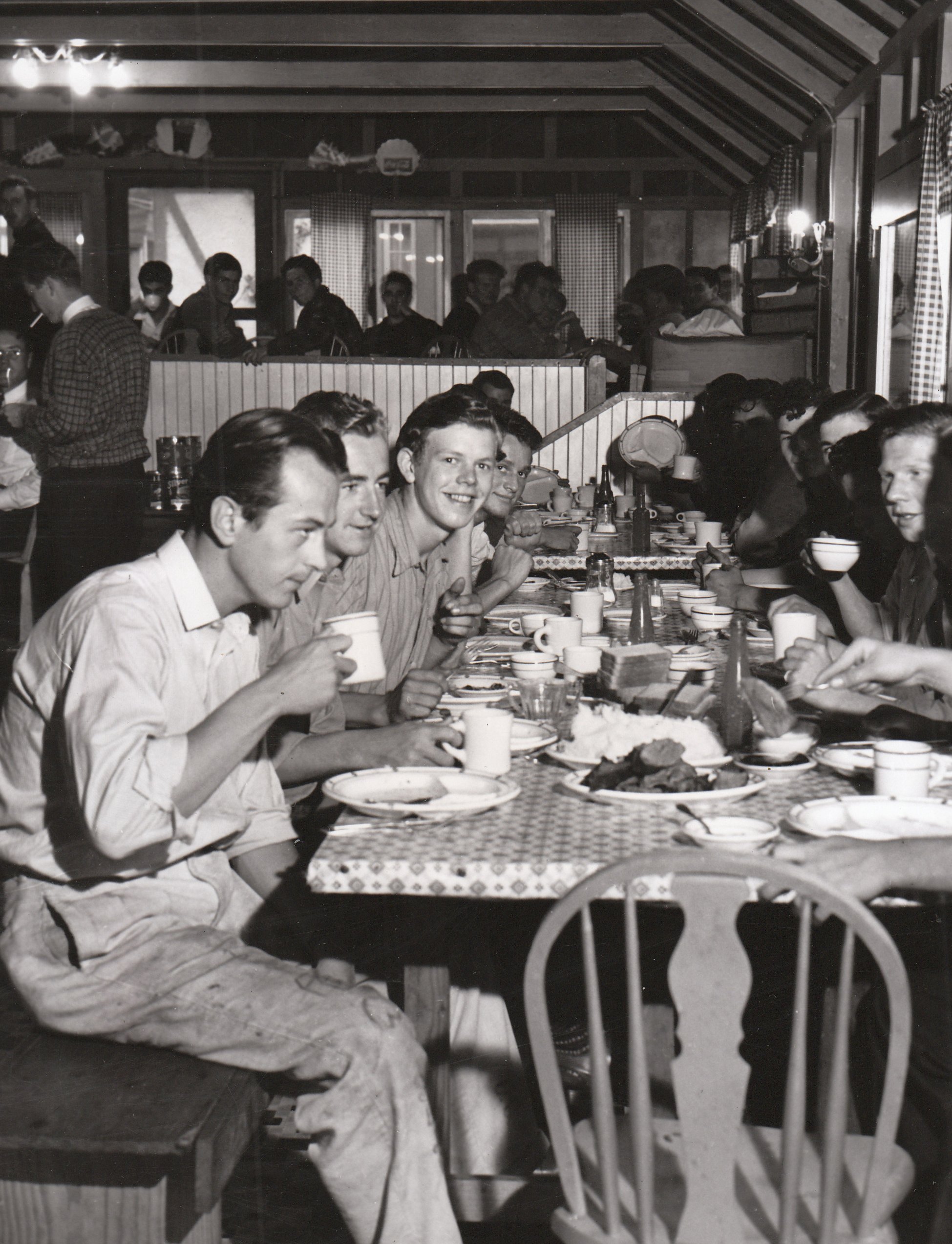 NYA workers having dinner together in San Diego. Employment, instead of the dole, seems to suit them just fine. Photo courtesy of the National Archives (ca. 1935-1943).