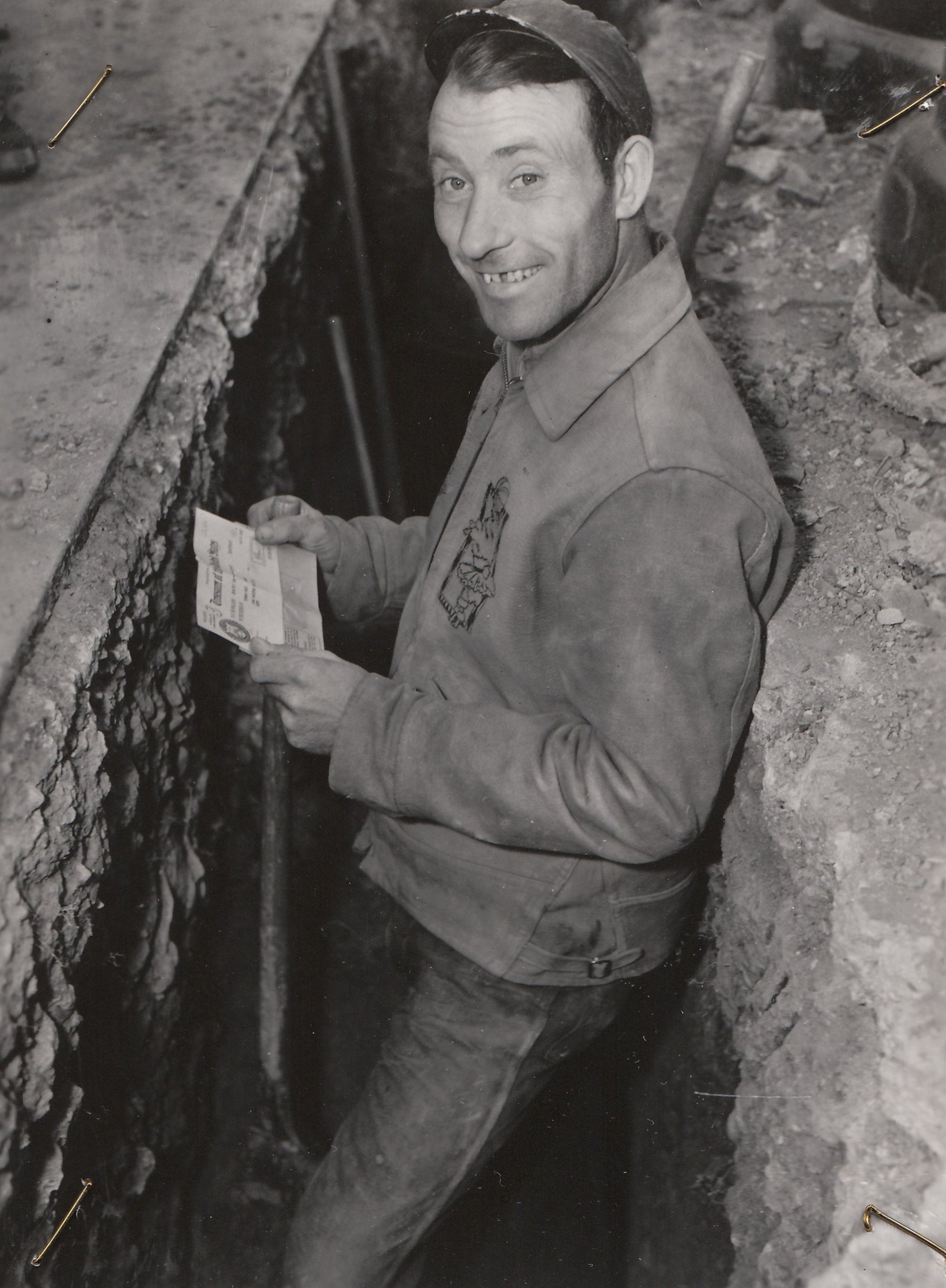 A WPA paycheck brings a smile in Washington, DC. Photo courtesy of the National Archives (January 1939).