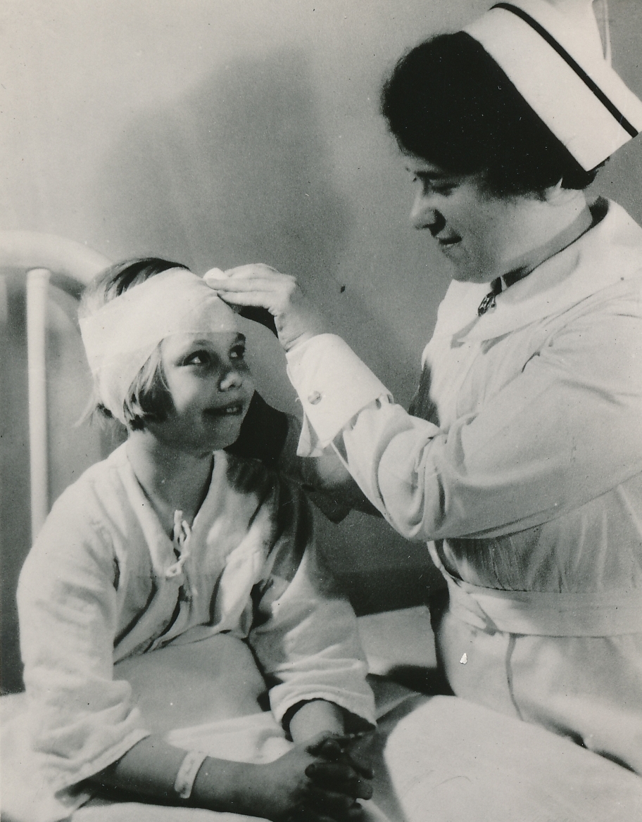 This child is happy to receive the expert care of a WPA nurse in Michigan. Photo courtesy of the National Archives (ca. 1935-1943).